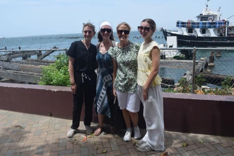 A quick family pic by the harbour on their family volunteer vacation in Jamaica